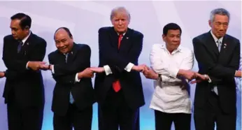  ?? MANAN VATSYAYANA/THE ASSOCIATED PRESS ?? Donald Trump looked to strengthen ties with Pacific Rim allies on the sidelines of the ASEAN conference.