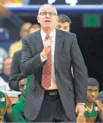  ?? Robert Franklin / Associated Press ?? Miami coach Jim Larranaga compares Lonnie Walker IV, who spent one season with the Hurricanes, to Danny Green and Jazz rookie Donovan Mitchell, an All-Rookie team pick.