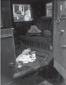  ?? CHICAGO TRIBUNE HISTORICAL PHOTO ?? The interior of the car where Assistant State’s Attorney William H. McSwiggin was shot and killed along with two others on April 27, 1926, shows hats and a cloth used to stop the flow of blood in the Lincoln automobile. James J. Doherty, a leader of a Cicero beer gang, was instantly killed with McSwiggin. Thomas Duffy, also in the car, died a few hours later at West Suburban Hospital.