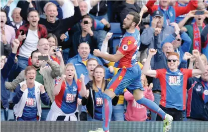  ??  ?? LONDON: Crystal Palace’s Serbian midfielder Luka Milivojevi­c celebrates scoring a goal off a penalty during the English Premier League football match between Crystal Palace and Hull City at Selhurst Park. — AFP