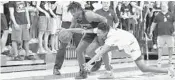  ?? MICHAEL LAUGHLIN/SUN SENTINEL ?? Wellington’s Linton Brown battles Cypress Bay’s Blake Alexis for the ball during their 9A regional final game.