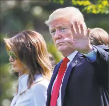  ?? Pablo Martinez Monsivais / Associated Press ?? President Donald Trump waves as he walks with first lady Melania Trump and their son, Barron, before boarding Marine One helicopter for the short flight to nearby Andrews Air Force Base, Maryland in June.