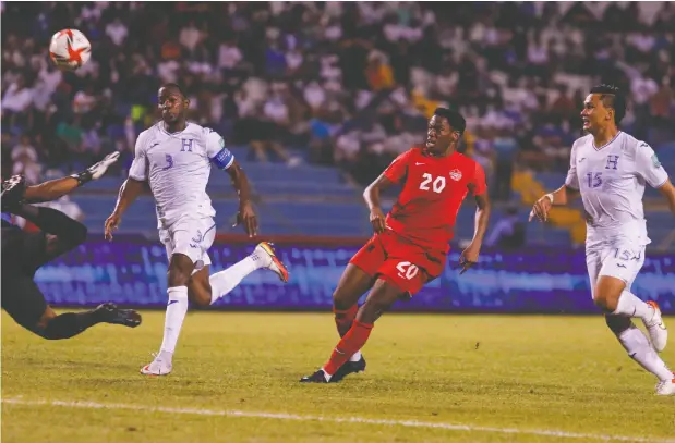  ?? DELMER MARTINEZ / THE ASSOCIATED PRESS ?? Canada’s Jonathan David scores against Honduras in a qualifying match for the FIFA World Cup Qatar 2022 in Honduras on Thursday.