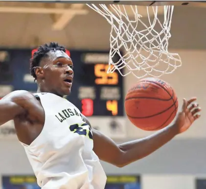  ?? JOE RONDONE / THE COMMERCIAL APPEAL ?? Lausanne’s Moussa Cisse was named Division II-A Mr. Basketball last season.