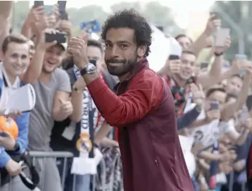  ?? — AP ?? Liverpool striker Mohamed Salah ( top) and Real Madrid forward Cristiano Ronaldo in Kiev on Thursday.