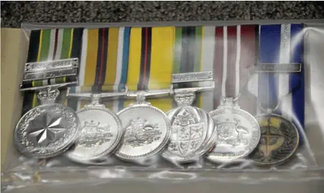  ?? Photos: Tara Miko ?? MISSION: Toowoomba police want to reunite these war medals, found in Rangeville on April 26 this year, with their rightful owner, along with a number of items at the property office.