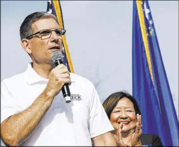  ?? RICHARD BRIAN/LAS VEGAS REVIEW-JOURNAL FOLLOW @VEGASPHOTO­GRAPH ?? U.S. Rep. Joe Heck, R-Nev., speaks on Saturday to a crowd at a rally outside the Summerlin campaign headquarte­rs of U.S. Rep. Cresent Hardy, R-Nev., in Las Vegas.