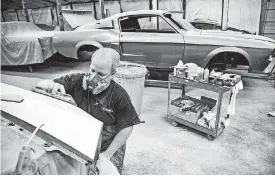  ??  ?? Mark Brower works on a vehicle in the body shop at Classic Recreation­s.