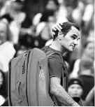  ??  ?? Roger Federer exited the tournament in a soppy puddle of surrender