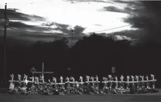  ?? Lisa Krantz / Staff file photo ?? A memorial for those who died in the massacre at First Baptist Church in Sutherland Springs is shown on U.S. 87 in December 2017, weeks after the shooting that killed 26 people.