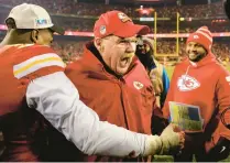  ?? REED HOFFMANN/AP ?? Chiefs coach Andy Reid, center, celebrates with defensive end Frank Clark, left, after they beat the Bengals in the AFC championsh­ip game Sunday in Kansas City, Missouri.