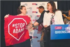  ?? OPPOSING VOICE: A protester interrupts Annastacia Palaszczuk as she delivers her speech after announcing the election date. ??