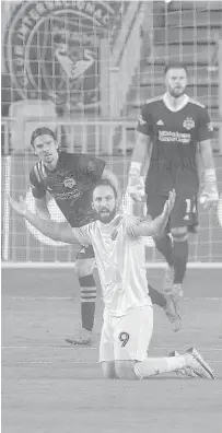  ?? MICHAEL LAUGHLIN/SUN SENTINEL ?? Inter Miami’s Gonzalo Higuain looks for a call against the Houston Dynamos during the second half of their match on Saturday.