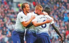  ?? Reuters ?? Tottenham’s Eric Dier celebrates scoring the first goal with Davinson Sanchez and Harry Kane during a Premier League match against Cardiff City. Spurs won 1-0.