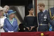  ?? MATT DUNHAM — THE ASSOCIATED PRESS FILE ?? Britain’s Queen Elizabeth II, Meghan the Duchess of Sussex and Prince Harry stand on a balcony to watch a flyby of Royal Air Force aircraft over Buckingham Palace in London. The timing couldn’t be worse for Harry and Meghan.