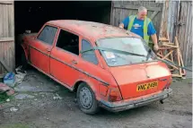  ?? ?? The British Leyland Maxi owned by Richard Greenwood, emerging from the garage where it has slumbered for the last 30 years, watched by its new owner, Mr Illingwort­h. JOHN SAGAR