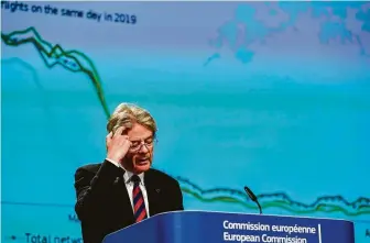 ?? Kenzo Tribouilla­rd / Associated Press ?? European Commission­er for the Economy Paolo Gentiloni, speaking in Brussels on Wednesday, said a recovery will probably start unevenly during the second half of the year.