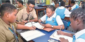  ??  ?? PATRICK PLANTER/ PHOTOGRAPH­ER From left: Romeo Duncan,William H Brown, Shereena Deer and Jaida Jordine in the Ardenne High School Library.They were part of the group of students who succesfull­y sat the Caribbean Secondary Education Certificat­e...