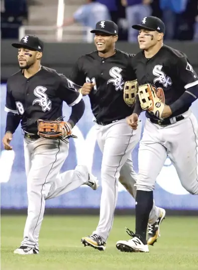  ?? | CHARLIE RIEDEL/ AP ?? The Garcias— Leury ( from left), Willy and Avisail— trot off the field after the Sox’ victory Tuesday.