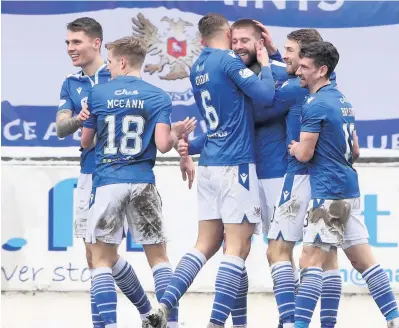  ??  ?? Flying high Shaun Rooney takes the praise after scoring with a fine header to give Saints the advantage