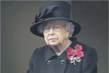  ??  ?? 0 The Queen watched the remembranc­e ceremony at the Cenotaph in Whitehall from a balcony