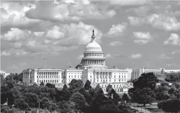  ?? Associated Press ?? The Capitol is seen June 20 from the roof of the Canadian Embassy in Washington. Health care is on the agenda for Congress when lawmakers return, and it's not another battle over the Obama-era Affordable Care Act. Instead of dealing with the uninsured, lawmakers are trying to bring down costs for people who already have coverage.