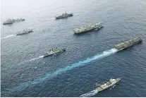  ?? JAY ALLEN/ASSOCIATED PRESS ?? Ships from England, Japan, Canada and the Netherland­s sail in the Pacific Ocean earlier this month. The U.S. and its allies have lately shown greater engagement in the Indo-Pacific region.