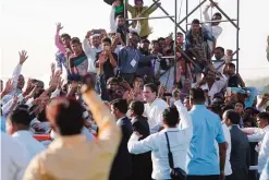  ??  ?? MEHSANA, India: India’s opposition Congress party vice-president Rahul Gandhi, center in white, meets supporters during a rally yesterday.