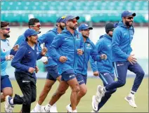  ??  ?? Indian cricketers warming up in the field.