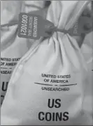  ??  ?? UNSEARCHED: Pictured above are the unsearched Vault Bags loaded with nearly 3 pounds of U.S. Gov’t issued coins some dating back to the 1800’s being handed over to Pennsylvan­ia residents by Federated Mint.