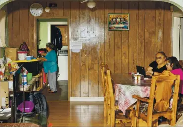  ?? MAGGIE SHANNON — THE NEW YORK TIMES ?? Patricia Reveles, middle, with her daughter at home in Los Angeles on Sept. 11. A number of women working in retail say they are being forced to choose between keeping their jobs and making sure their children can keep up with remote learning.