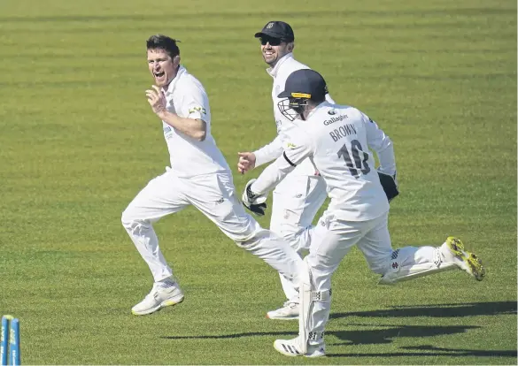  ?? Picture: Andrew Matthews/PA Wire. ?? Hampshire’s Liam Dawson, left, took two of the four Kent wickets to fall on an engrossing final day at Canterbury