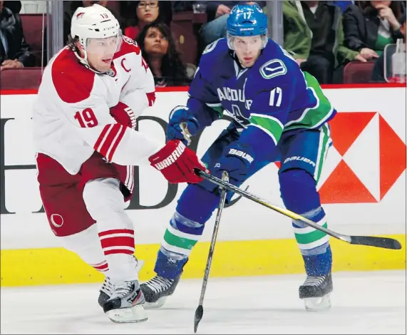  ?? — GETTY IMAGES FILES ?? Coyotes captain Shane Doan, left, shown here battling against Canucks forward Ryan Kesler, has been part of the Phoenix team for 17 years. He has no intention on moving elsewhere, as evidenced by the four-year contract extension he signed with the team.