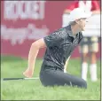  ?? CARLOS OSORIO — THE ASSOCIATED PRESS ?? Cam Davis smiles after sinking his chip shot from the sand on No. 17 for eagle in the Rocket Mortgage Classic.