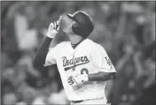  ?? ASSOCIATED PRESS ?? LOS ANGELES DODGERS’ Manny Machado celebrates after hitting a three-run home run during the third inning of Saturday’s game against the San Diego Padres in Los Angeles.