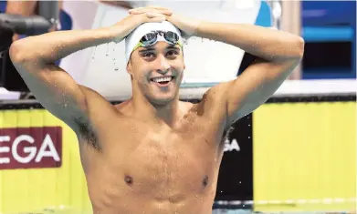  ?? PICTURE: EPA ?? A CHAMPION’S SMILE: Chad le Clos celebrates his victory in the men’s 200m Butterfly final at the 17th FINA Swimming World Championsh­ips in the Duna Arena in Budapest, Hungary last night.