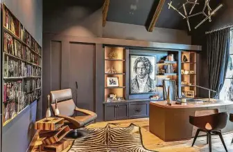 ??  ?? Shelving and cabinets in Victor Palafox’s home office revolve around a favorite painting, Vik Muniz’s Beethoven portrait.