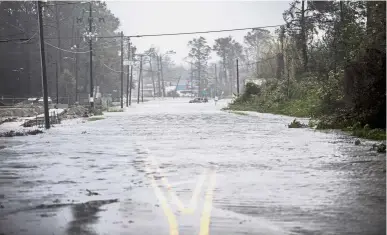  ??  ?? Nowhere to go: A street in Wilmington is submerged as Hurricane Florence hammered North Carolina. — Bloomberg