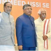  ?? — PAVAN ?? Union minister for IT and Law Ravi Shankar Prasad (center) along with BJP MP Bandaru Dattatraya and BJP state president Dr. K. Laxman in Hyderabad.