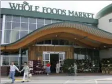  ?? AP PHOTO - LM OTERO ?? In this May 9, 2007, file photo, customers are seen outside a Whole Foods Market in Dallas. Online juggernaut Amazon announced Friday, June 16, 2017, that it is buying Whole Foods in a deal valued at about $13.7 billion, including debt. Amazon.com Inc....