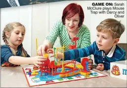  ??  ?? GAME ON: Sarah McClure plays Mouse Trap with Darcy and Oliver