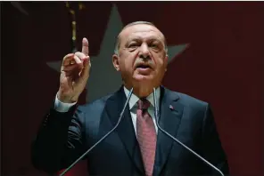  ?? AP ?? Turkish President Recep Tayyip Erdogan speaks at a gathering Friday in Ankara, where he demanded that Saudi leaders reveal the location of the body of slain journalist Jamal Khashoggi.