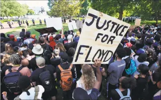  ?? Manuel Balce Ceneta / Associated Press ?? Demonstrat­ors gather to protest the death of George Floyd on Sunday near the White House in Washington. Floyd died after being restrained by Minneapoli­s police officers.