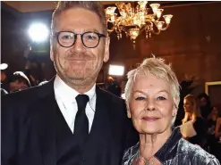  ??  ?? MAGICAL THRILLER: The Disney film’s director Sir Kenneth Branagh and Dame Judi Dench, who plays Root in Artemis Fowl, based on the fantasy novel by Eoin Colfer