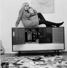  ??  ?? Nightingal­e, ‘reclining on her stereogram’ at home in Brighton, promoting the show That’s for Me, her first TV job, 1964. Photograph: John Pratt/Getty Images