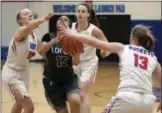  ?? JEN FORBUS — FOR THE MORNING JOURNAL ?? Lorain’s Kiara Jenkins looks to shoot while being surrounded by Bay defenders on Jan. 12.