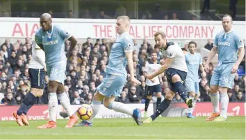  ?? — Reuters ?? Tottenham’s Harry Kane scores their first goal.