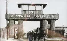  ??  ?? Imposing: Stalag 1VB entrance and watchtower, below