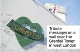  ??  ?? Tribute messages on a wall near the Grenfell Tower in west London