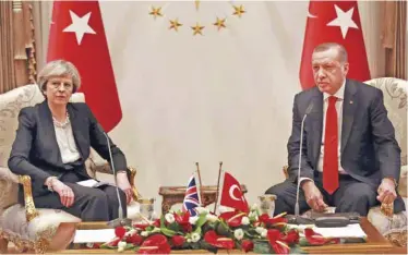  ??  ?? ANKARA: Turkey’s President Recep Tayyip Erdogan (right) and British Prime Minister Theresa May speak after their meeting at the presidenti­al complex in Ankara yesterday. — AFP